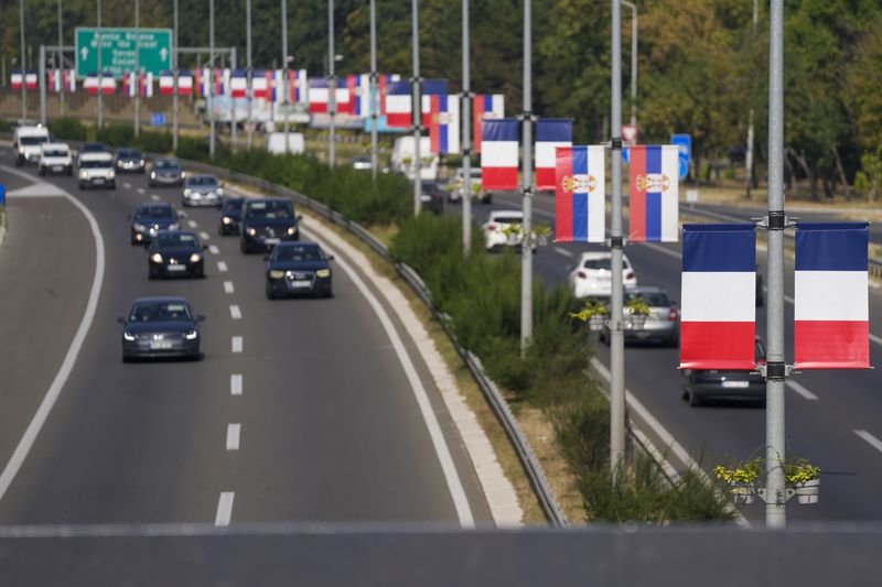 French and Serbian flags fly on lampposts on a highway in Belgrade, Serbia, Thursday, Aug. 29, 2024, ahead of French President Emmanuel Macron two-day state visit to Serbia. (AP Photo/Darko Vojinovic)