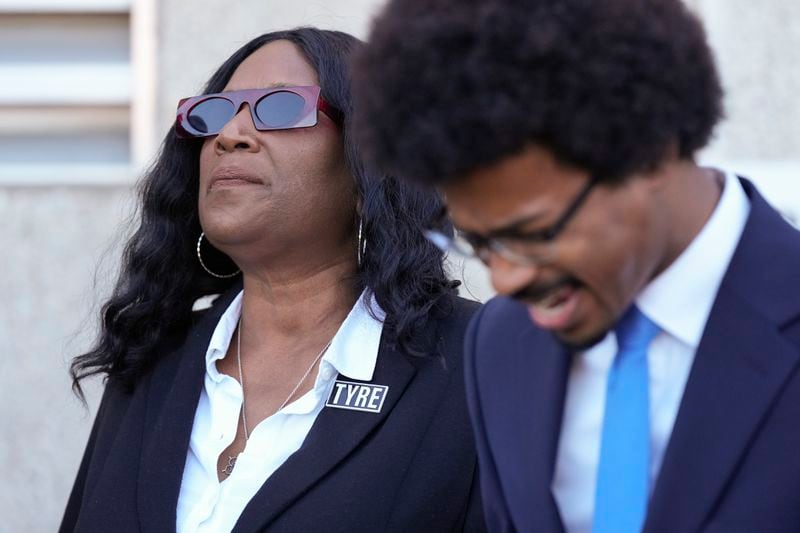 RowVaughn Wells, left, mother of Tyre Nichols, prays with Rep. Justin J. Pearson, D-Memphis, right, before entering the federal courthouse for the trial of three former Memphis police officers charged in the 2023 fatal beating of her son Wednesday, Oct. 2, 2024, in Memphis, Tenn. (AP Photo/George Walker IV)