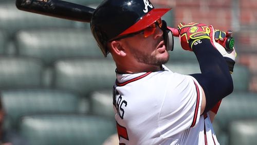 Braves' Tyler Flowers hits a solo home run for a 7-3 lead over the St. Louis Cardinals during the 8th inning.   Curtis Compton/ccompton@ajc.com