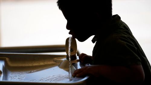 FILE - A student drinks from a water fountain at an elementary school in California on Sept. 20, 2023. (AP Photo/Marcio Jose Sanchez, File)