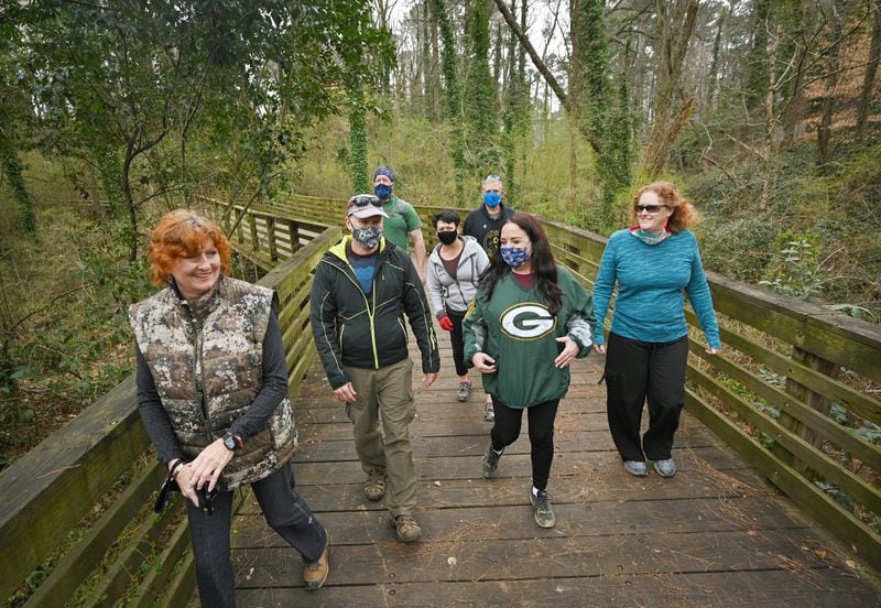 Sue Sewell (From left) Steve Novotny, Allan Grove, Annette M. Waddell, Tom McGuire, Stacy Fox and Barbara Grove walk the Whetstone Trail in Atlanta's Westside earlier this month. Volunteering at Habitat for Humanity was an important weekend social activity. When the coronavirus pandemic shut that down, they started doing socially distanced hikes around Atlanta. (Hyosub Shin / Hyosub.Shin@ajc.com)