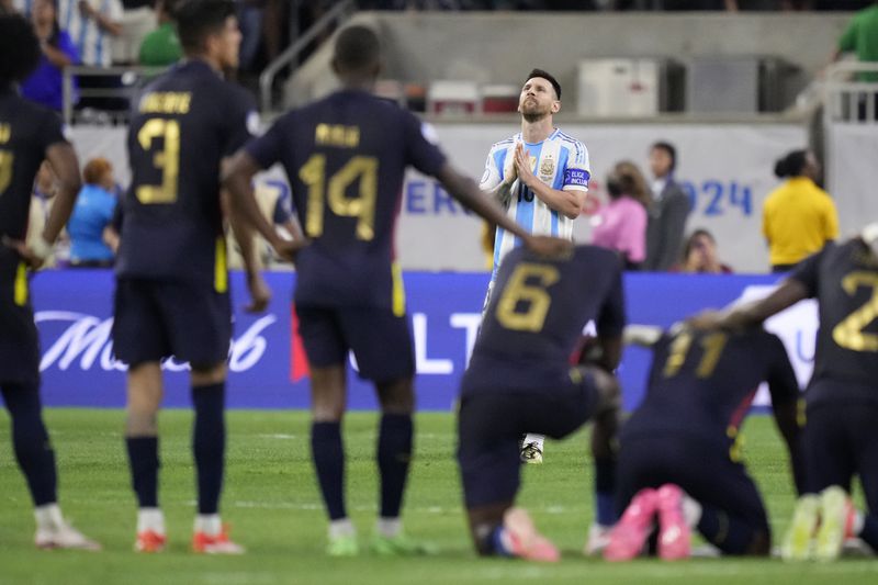 Argentina's Lionel Messi reacts during a penalty shootout against Ecuador at a Copa America quarterfinal soccer match in Houston, Thursday, July 4, 2024.(AP Photo/Kevin M. Cox)