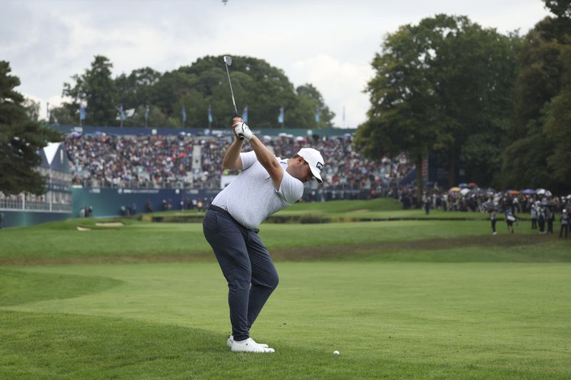 Thirston Lawrence of South Africa plays a shot to the 18th green from the fairway during the final round of the British PGA golf Championship at Wentworth golf club in Wentworth, England, Sunday, Sept. 22, 2024. (AP Photo/Ian Walton)