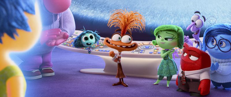 This image released by Disney/Pixar shows, from left, Joy, voiced by Amy Poehler, Embarrassment, voiced by Paul Walter Hauser, Envy, voiced by Ayo Edebiri, Anxiety, voiced by Maya Hawke, Disgust, voiced by Liza Lapira, Anger, voiced by Lewis Black (foreground), Fear, voiced by Tony Hale, and Sadness, voiced by Phyllis Smith, in a scene from "Inside Out 2." (Disney/Pixar via AP)