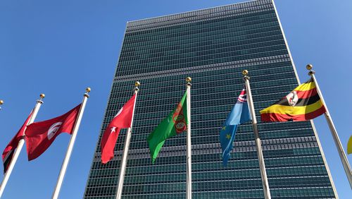 FILE - Flags fly outside the United Nations headquarters during the 74th session of the United Nations General Assembly, Sept. 28, 2019. (AP Photo/Jennifer Peltz, File)