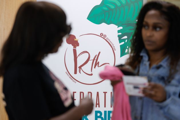 Kimberly Seals Allers (left), creator of an app called Irth talks to a mother during a launch event at Sheltering Arms Educare Center on Thursday, June 15, 2023. The app is  “Yelp-like” review and rating platform for Black mothers to share birthing experiences to help make Black birth safer. Infant health is tied strongly to maternal health. (Natrice Miller/ Natrice.miller@ajc.com)