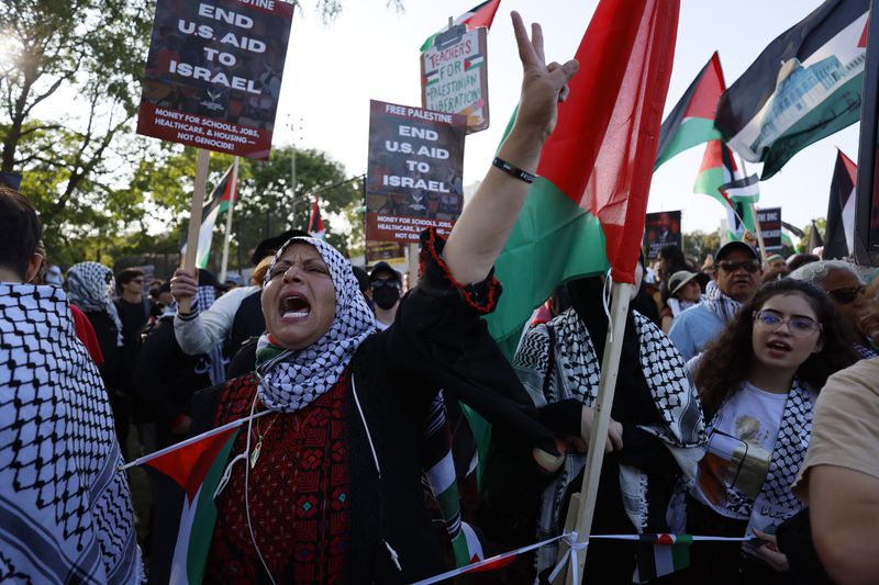 Gawahir Kamil from Georgia chants during a demonstration near the  Democratic National Convention in Chicago.