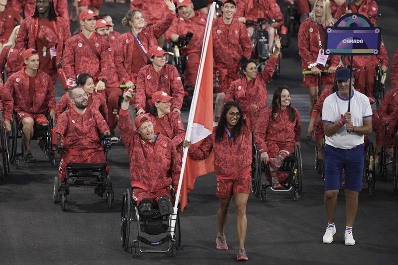 FILE - Canada athletes parade during the Opening Ceremony for the 2024 Paralympics, Wednesday, Aug. 28, 2024, in Paris, France. (AP Photo/Emilio Morenatti, File)