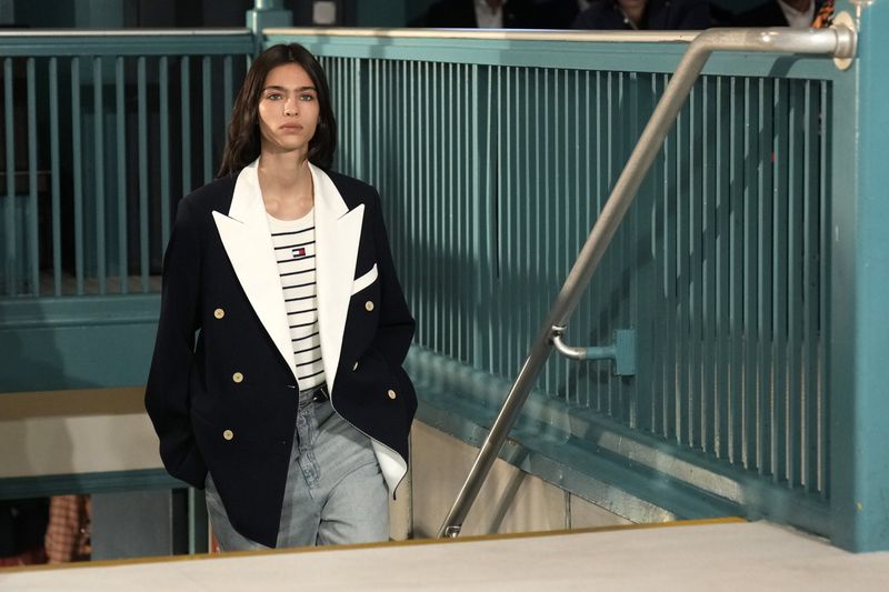 A model walks the runway during the Tommy Hilfiger Spring/Summer 2025 fashion show onboard a Staten Island Ferry as part of New York Fashion Week on Sunday, Sept. 8, 2024, in New York. (Photo by Charles Sykes/Invision/AP)