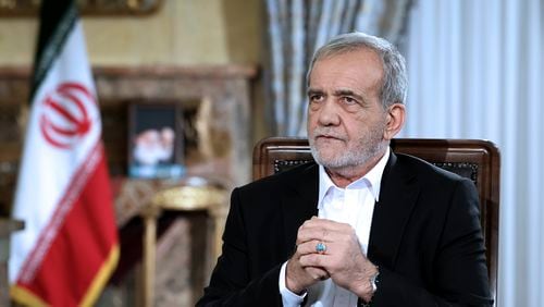 In this photo released by the Iranian Presidency Office, President Masoud Pezeshkian speaks in a live televised interview by state TV, at his office in Tehran, Iran, Saturday, Aug. 31, 2024. (Iranian Presidency Office via AP)