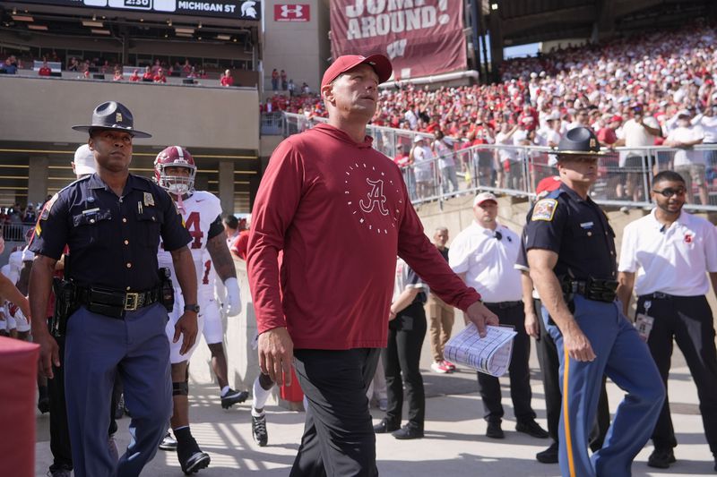 Alabama head coach Kalen DeBoer leads his team on the field before an NCAA college football game against Wisconsin Saturday, Sept. 14, 2024, in Madison, Wis. (AP Photo/Morry Gash)