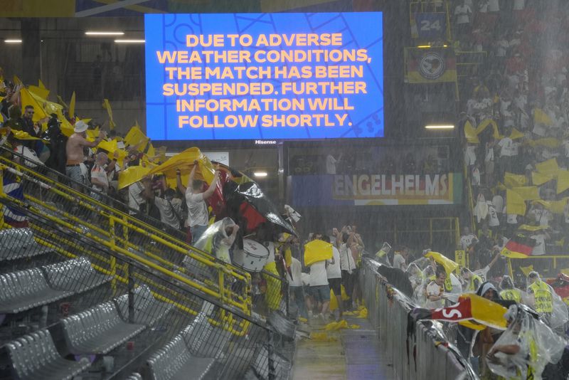 A sign announces that the match has been suspended due to adverse weather during the round of sixteen match between Germany and Denmark at the Euro 2024 soccer tournament in Dortmund, Germany, Saturday, June 29, 2024. (AP Photo/Martin Meissner)