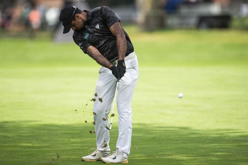 Aaron Rai competes in the third round of the PGA Rocket Mortgage Classic golf tournament, Saturday, June 29, 2024, at the Detroit Golf Club in Detroit. (Katy Kildee/Detroit News via AP)
