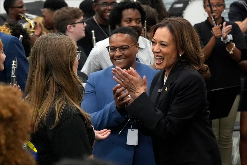 Democratic presidential nominee Vice President Kamala Harris speaks to marching band members at Liberty County High School in Hinesville, Ga., Wednesday, Aug. 28, 2024. (AP Photo/Jacquelyn Martin)