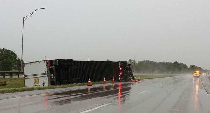 High winds associated with the morning severe weather overturned this semi-trailer on Interstate 280 west of Davenport, Iowa on Friday, May 24, 2024. Several tornadoes were reported in Iowa and Illinois as storms downed power lines and trees on Friday, just after a deadly twister devastated one small town.(Roy Dabner/Quad City Times via AP)