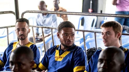 Tyler Thompson, left, Marcel Malanga and Benjamin Reuben Zalman-Polun, all American citizens, attend a court verdict in Congo, Kinshasa, Friday Sept .13, 2024, on charges of taking part in a coup attempt in May 2024. (AP Photo/Samy Ntumba Shambuyi)