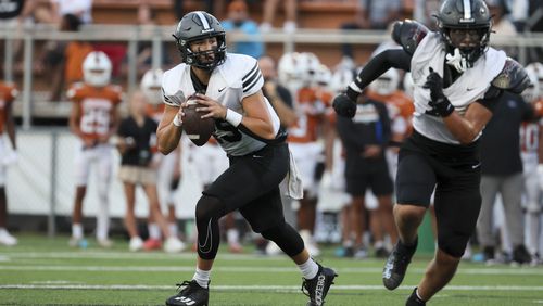 North Atlanta quarterback Ian Reynolds (15) rolls out of the pocket as he looks to pass against Kell during the first half of the Corky Kell Dave Hunter Classic at Kell High School, Wednesday, August 14, 2024, in Marietta, Ga. (Jason Getz / AJC)
