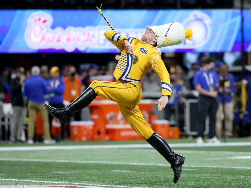 Pittsburgh Panthers' drum major performs before the Chick-fil-A Peach Bowl between the Pittsburgh Panthers and the Michigan State Spartans at Mercedes-Benz Stadium in Atlanta, Thursday, December 30, 2021. JASON GETZ FOR THE ATLANTA JOURNAL-CONSTITUTION



