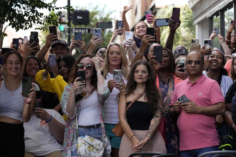 People line the sidewalk Thursday waiting for Vice President Kamala Harris, the Democratic presidential nominee, to leave after a stop at Dottie's Market in Savannah. (AP Photo/Jacquelyn Martin)