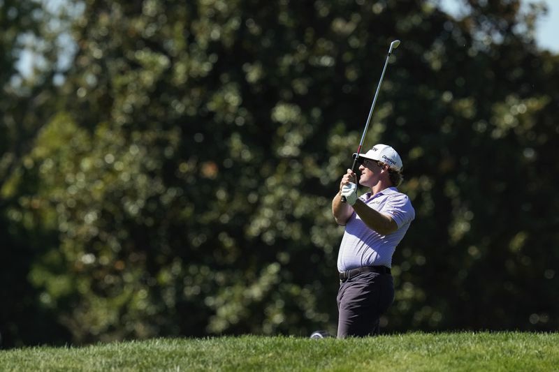 Wilson Furr watches his shot from the rough on the 18th hole during the third round of the Procore Championship golf tournament at the Silverado Resort North Course, Saturday, Sept. 14, 2024, in Napa, Calif. (AP Photo/Godofredo A. Vásquez)