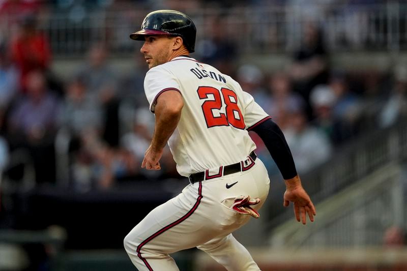 Atlanta Braves first baseman Matt Olson (28) gets caught between third base and home in the third inning of a baseball game against the Philadelphia Phillies, Thursday, Aug. 22, 2024, in Atlanta. (AP Photo/Mike Stewart)