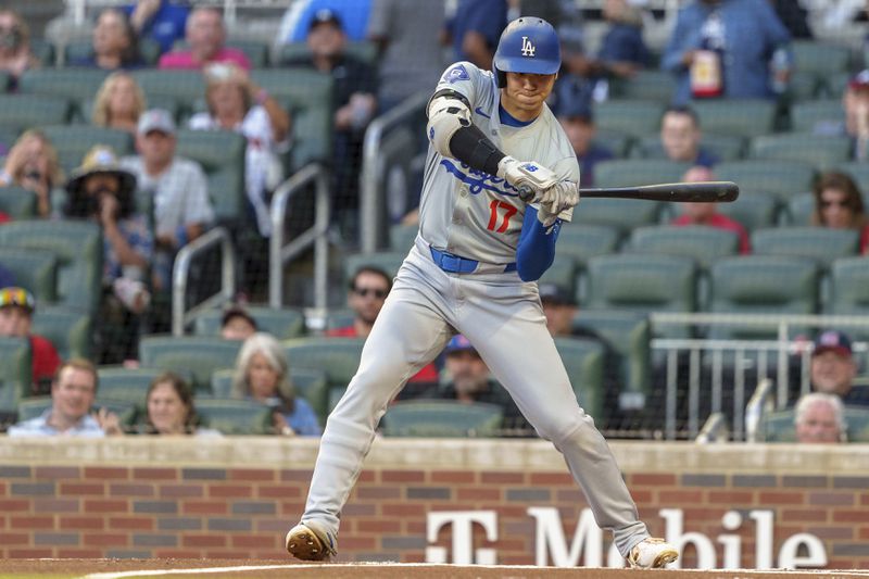 Los Angeles Dodgers' Shohei Ohtani watches a pitch go by called strike in the first inning of a baseball game against the Atlanta Braves, Monday, Sept. 16, 2024, in Atlanta. (AP Photo/Jason Allen)