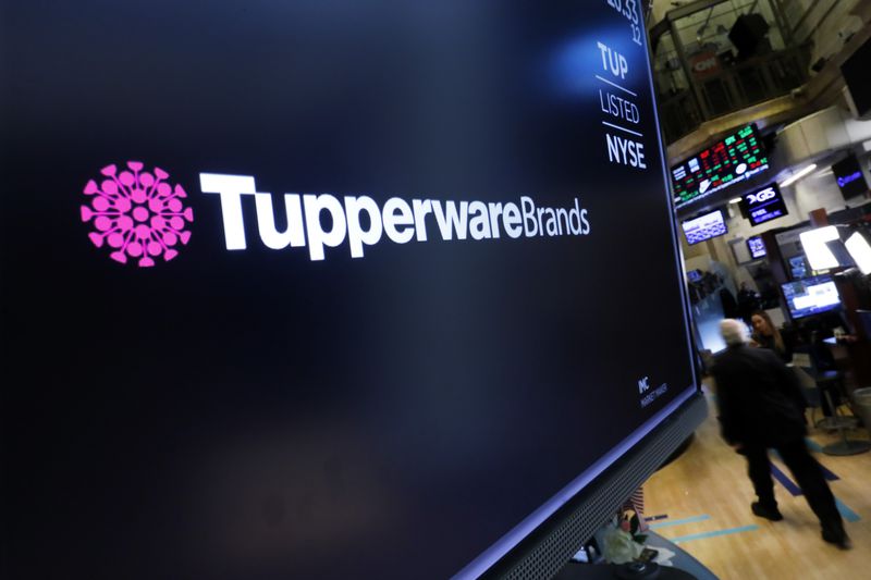 FILE - The logo for Tupperware Brands appears on a monitor on the floor of the New York Stock Exchange on Oct. 30, 2019. (AP Photo/Richard Drew, File)