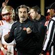 Rome head coach John Reid talks with an official during their game against Langston Hughes in the Class 6A semi-final at Lakewood Stadium, Friday, December 2, 2022, in Atlanta. Jason Getz / Jason.Getz@ajc.com)
