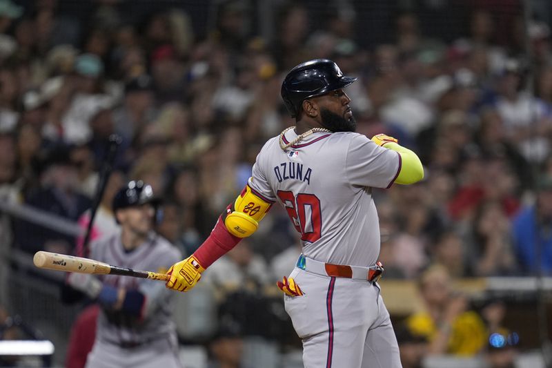 Atlanta Braves' Marcell Ozuna watches his home run during the ninth inning of a baseball game against the San Diego Padres, Friday, July 12, 2024, in San Diego. (AP Photo/Gregory Bull)