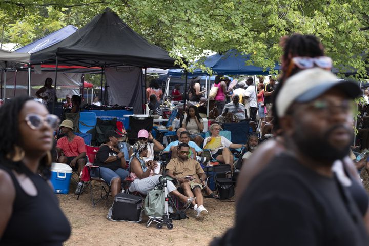 People chill and listen to DJ Kemit during the 20th anniversary of the House In The Park music festival in Grant Park in Atlanta on Sunday, Sept. 1, 2024. (Ben Gray / Ben@BenGray.com)