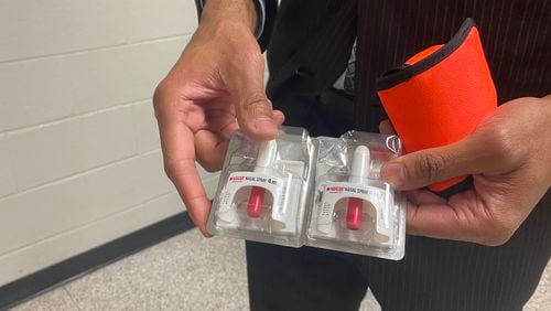 Berkmar High School Principal Durrant Williams shows Narcan nasal spray available in his school to block the effects of a drug overdose. (Josh Reyes / Joshua.Reyes@ajc.com)