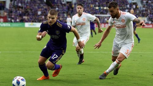 Atlanta United centerback Leandro Gonzalez Pirez defends an Orlando City player last season. (Atlanta United)