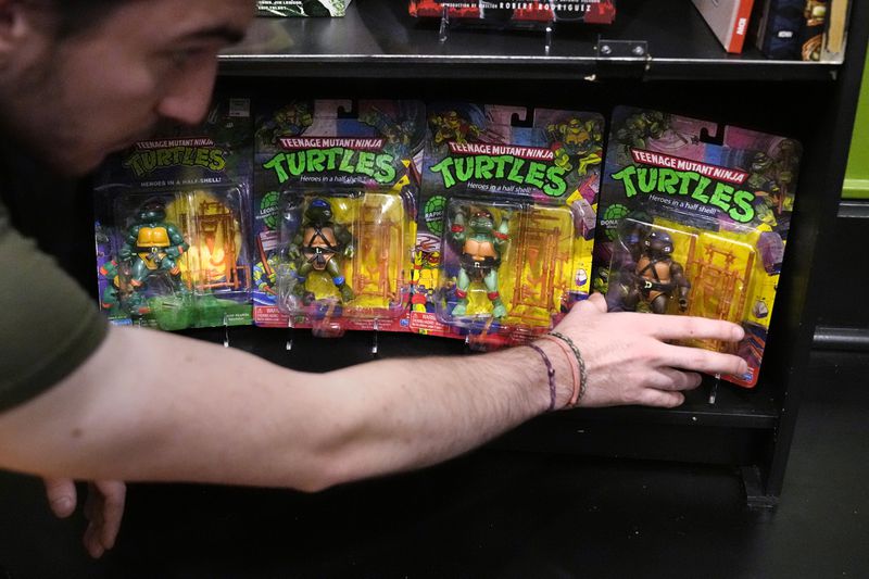 John Cookson, operations manager at the Woodman Museum, shows first edition Teenage Mutant Ninja Turtles action figures, which are part of the museum's permanent collection, Thursday, Sept. 5, 2024, in Dover, N.H. (AP Photo/Charles Krupa)