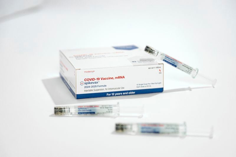 This photo provided by Moderna in August 2024 shows packaging and syringes for the company's updated COVID vaccine for ages 12 and older approved by the U.S. Food and Drug Administration on Thursday, Aug. 22, 2024. (Moderna via AP)