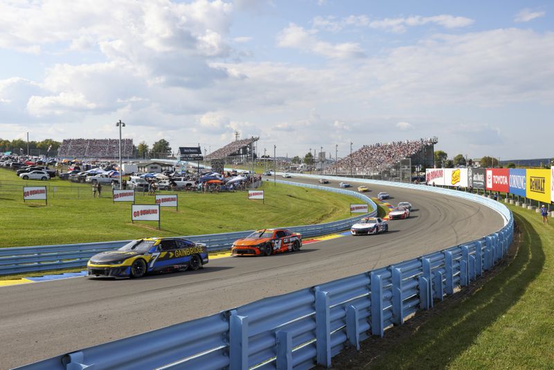 Corey LaJoie (7) competes during a NASCAR Cup Series auto race, Sunday, Sept. 15, 2024, in Watkins Glen, N.Y. (AP Photo/Lauren Petracca)