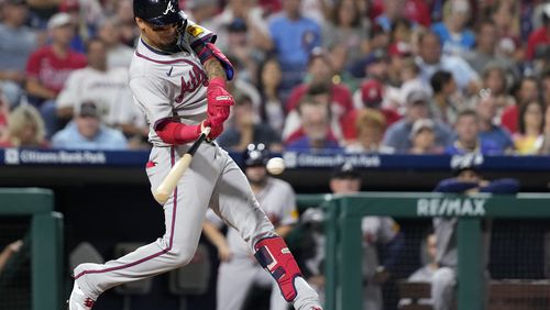 Atlanta Braves' Orlando Arcia hits a home run against Philadelphia Phillies pitcher Max Lazar during the sixth inning of a baseball game, Friday, Aug. 30, 2024, in Philadelphia. (AP Photo/Matt Slocum)