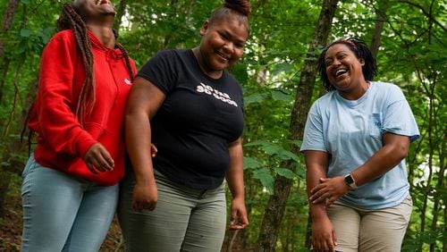 LaBrittany Kroger, right, Jaelyn Romero, center, and Shaqueshia Taylor, laugh while participating in a team building exercise as part of a Kennesaw State week long residential summer camp called “GEAR’ing UP for College,” on Thursday, July 11, 2019, in Kennesaw. ELIJAH NOUVELAGE/SPECIAL TO THE AJC