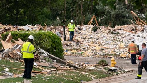 Crew workers remove the debris after a house exploded in Bel Air, Md. neighborhood on Sunday, Aug. 11, 2024. (AP Photo/Jose Luis Magana)