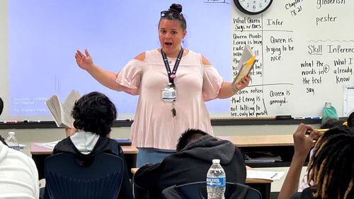 Fulton County teacher Jennifer Dallas works with a fifth grade class on making inferences using a book called "The Broken Bike Boy and the Queen of 33rd Street." Fulton is revamping its reading program to focus on the five pillars of literacy as defined by the National Reading Panel. (Martha Dalton/martha.dalton@ajc.com)