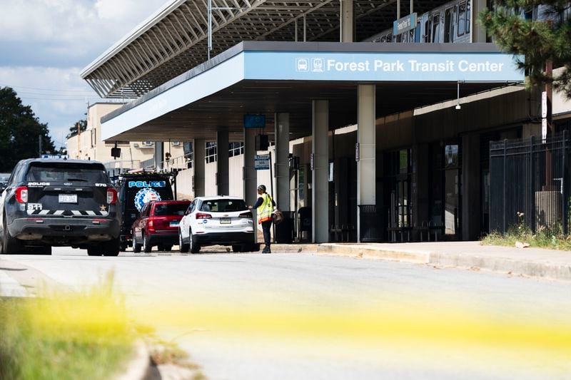 Yellow tape blocks off the parking lot of the Forest Park Blue Line train station in Forest Park, Ill., after four people were fatally shot on the train early Monday, Sept. 2, 2024. (Pat Nabong/Chicago Sun-Times via AP)