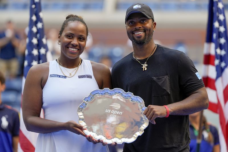 Taylor Townsend, of the United States, and Donald Young, of the United States, hold up the runner-up trophy after losing to Sara Errani, of Italy, and Andrea Vavassori, of Italy, during the mixed doubles final of the U.S. Open tennis championships, Thursday, Sept. 5, 2024, in New York. (AP Photo/Julia Nikhinson)