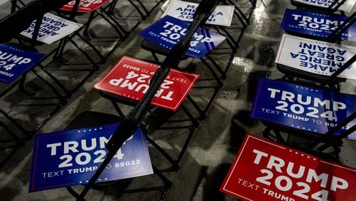 
                        FILE — Campaign signs for former president Donald Trump cover chairs before a campaign event in Waterford, Mich., Feb. 17, 2024. Trump won commanding victories over Nikki Haley on Super Tuesday that pushed her from the race, but he does not appear to have broadened his support beyond the Republican base. (Emily Elconin/The New York Times)
                      