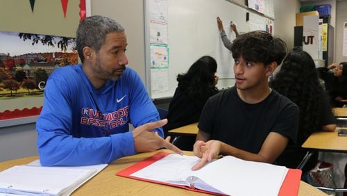 Riverwood HIgh's Buck Jenkins (left) was one of the first teachers to join the school's AVID launch 10 years ago. Courtesy