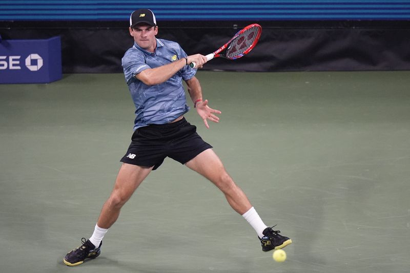 Tommy Paul returns a shot to Italy's Lorenzo Sonego during a first-round match of the U.S. Open tennis championships, Tuesday, Aug. 27, 2024, in New York. (AP Photo/Frank Franklin II)