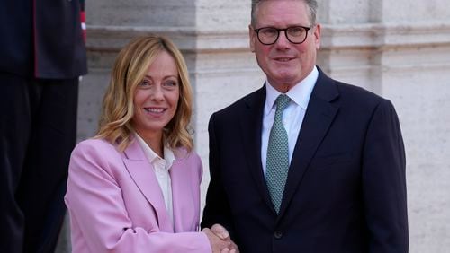 Italian Premier Giorgia Meloni, left, welcomes U.K. Prime Minister Keir Starmer as they meet at Villa Panphilj in Rome, Monday, Sept. 16, 2024. U.K. Prime Minister Keir Starmer is meeting Italian Premier Giorgia Meloni in Rome on Monday, as the two very different politicians, from left and right, seek common cause to curb migrants reaching their shores by boat. The visit comes after at least eight seaborne migrants died off the French coast over the weekend. (AP Photo Andrew Medichini)