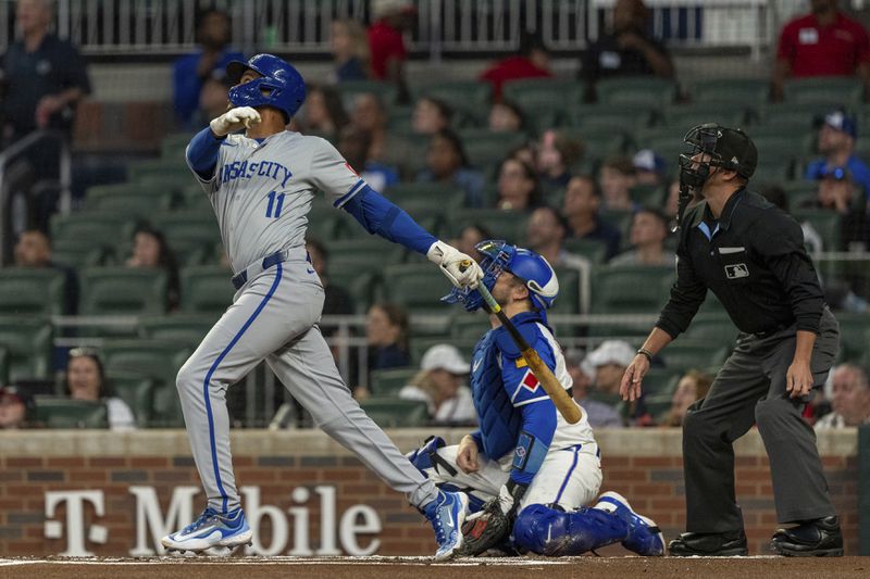 Kansas City Royals' Maikel Garcia looks to his hit to see if it stays within play in the first inning of a baseball game against the Atlanta Braves, Saturday, Sept. 28, 2024, in Atlanta. (AP Photo/Jason Allen)