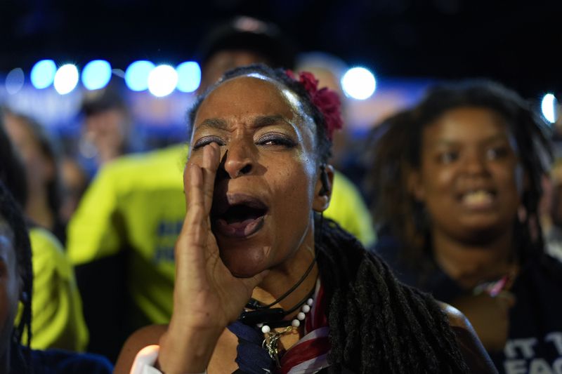 Attendees cheer as Democratic presidential nominee Vice President Kamala Harris speaks at a rally on Sunday, Sept. 29, 2024, in Las Vegas. (AP Photo/Carolyn Kaster)