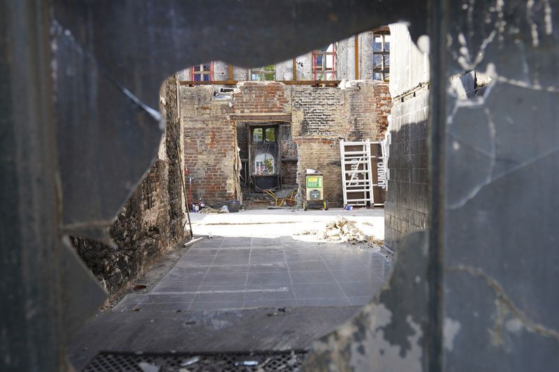 Remains of Copenhagen's Old Stock Exchange building are seen through a broken glass window in Copenhagen, Denmark, Thursday, Sept. 19, 2024. (AP Photo James Brooks)