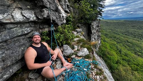 In this image provided by Michael Levy, New York Jets offensive lineman Wes Schweitzer takes a break after scaling the Shawangunk Mountains in New York in 2024. (Michael Levy via AP)