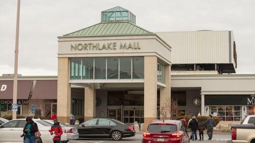 Pedestrians mill through the parking lot of Northlake Mall in DeKalb County.